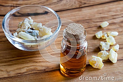 A bottle of frankincense essential oil with frankincense crystal Stock Photo