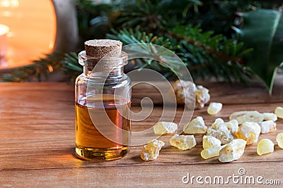 A bottle of frankincense essential oil with frankincense resin Stock Photo