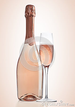 Bottle and glass of pink rose champagne on pink Stock Photo