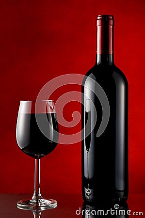 Bottle and glass of red wine Stock Photo