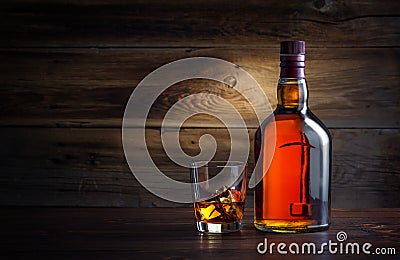 Bottle and glass of whiskey Stock Photo