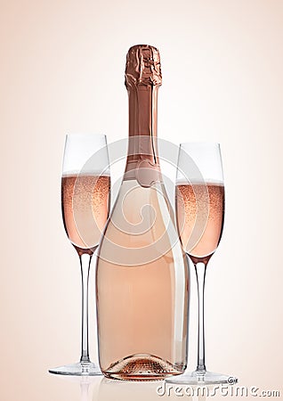 Bottle and glasses of pink rose champagne on pink Stock Photo