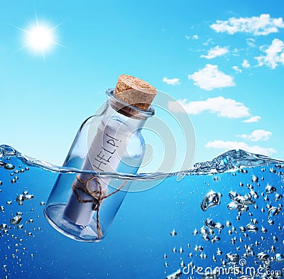 Bottle with help message. Stock Photo