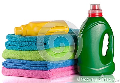 bottle laundry detergent and conditioner with towels isolated on Stock Photo