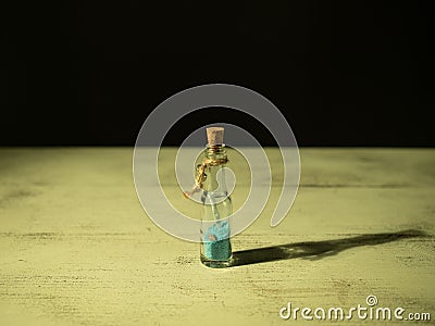 Bottle locked inside a rolled up letter Stock Photo