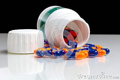 Bottle of medical pills or capsules isolated over white Stock Photo