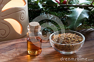 A bottle of myrrh essential oil with myrrh resin in a glass bottle Stock Photo