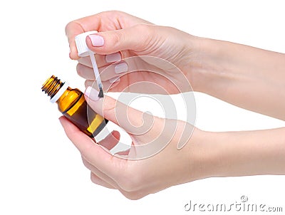 Bottle Nail Oil Cuticle in hand Stock Photo