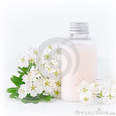 A bottle of natural baby cosmetic with flowers Stock Photo