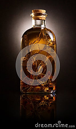 Bottle with oil and aromatic herbs Stock Photo