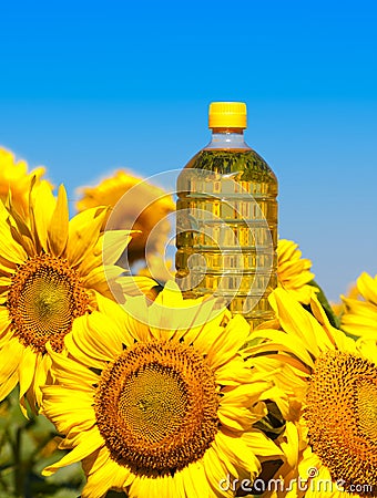 Bottle of oil with sunflowers Stock Photo