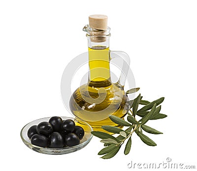 A bottle with olive oil, black olives on a plate and olive branch with leaves on a white background Stock Photo