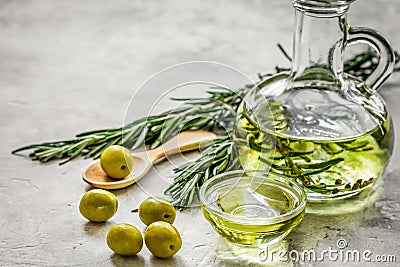 Bottle with olive oil and herbs on stone background mockup Stock Photo