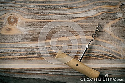 Bottle openeron wooden table background Stock Photo