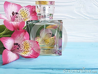 Bottle of perfume flower alstroemeria beautiful on a wooden background Stock Photo