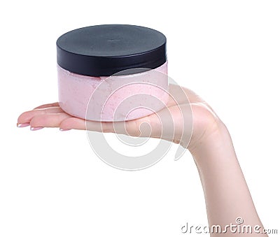 Bottle pink scrub for body in hand Stock Photo