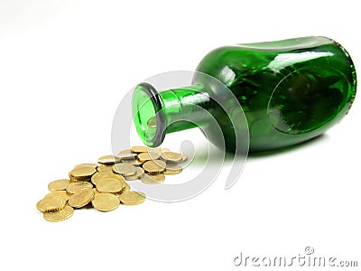 Bottle pouring gold (side view) Stock Photo