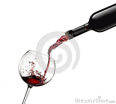 Bottle pouring red wine in glass with splashes Stock Photo