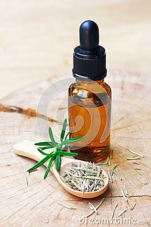 A bottle of rosemary aromatherapy oil extract Stock Photo