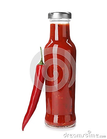 Bottle with spicy chili sauce and fresh pepper Stock Photo