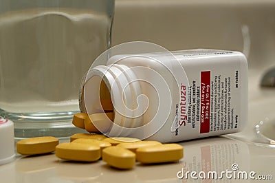 Bottle of Symtuza medication to treat HIV infection in bathroom at home. Chronic illness, modern medicine Editorial Stock Photo