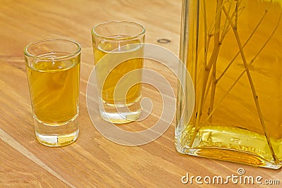 Bottle and two shots of homemade herbal liquor Stock Photo