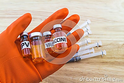 Bottle vaccine of Human papillomavirus HPV vaccine in red glove Stock Photo