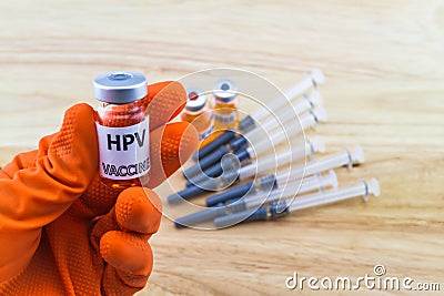 Bottle vaccine of Human papillomavirus (HPV) vaccine in red glo Stock Photo