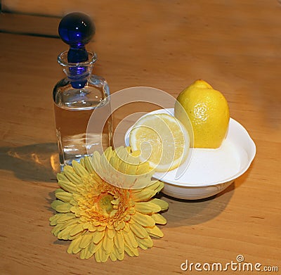 A bottle of water, with sugar and lemon for Sugaring, an alternative method of the hair shave Stock Photo