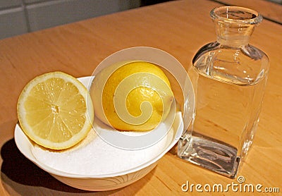 A bottle of water, with sugar and lemon for Sugaring, an alternative method of the hair shave Stock Photo