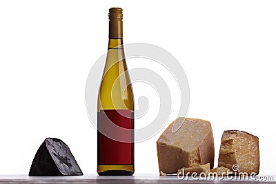 A bottle of white wine, expensive cheese, musty cheese, black cheese. Stock Photo