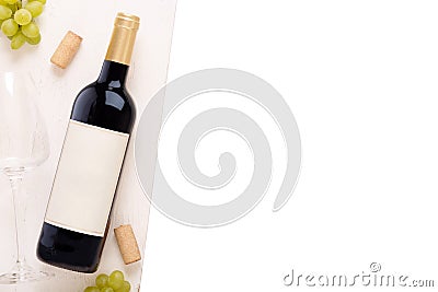 Bottle of white wine with label. Glass of wine and cork. Wine bottle mockup Stock Photo