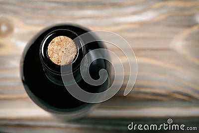 Bottle of wine on wooden table Stock Photo