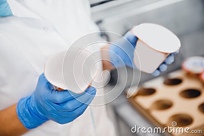 Bottle of yoghurt on automated conveyor line, process of milk filling and packaging, Dairy production Stock Photo