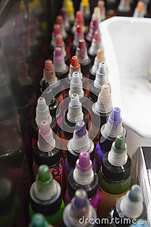 Bottles of colourful tattoo inks, in a tattoo parlor box Stock Photo