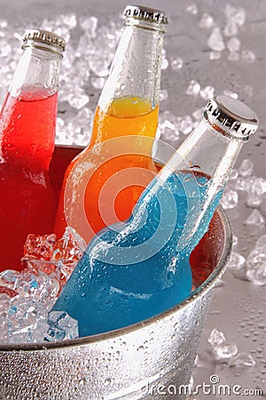 Bottles of cool drinks in ice bucket Stock Photo