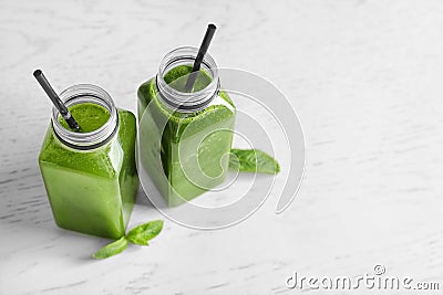 Bottles with delicious detox juice Stock Photo