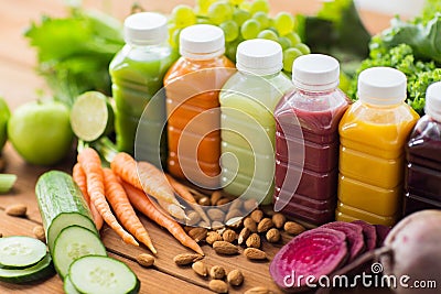 Bottles with different fruit or vegetable juices Stock Photo