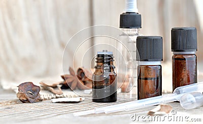 Bottles of essential oil and spices with pipette to extract essence Stock Photo
