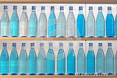 Bottles filled with water, standing on the shelf Stock Photo