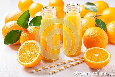 Bottles of fresh orange juice with fresh fruits Stock Photo