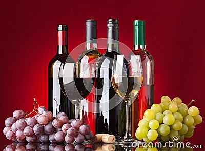 Bottles, glasses and grapes Stock Photo