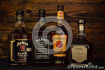 Bottles of Jack Daniels, Four Roses, Jim Beam, Jack Daniels Single Barrel premium American whiskey on a dark wooden Editorial Stock Photo