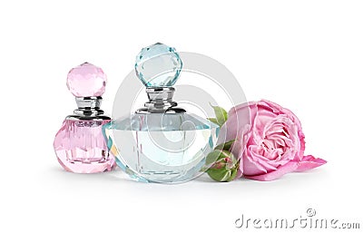 Bottles of luxury perfume and beautiful flower on white Stock Photo