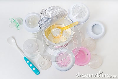 Bottles and milk formula in can for feeding infant Stock Photo