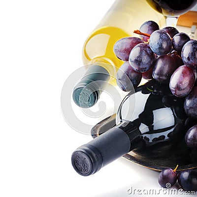 Bottles of red and white wine with fresh grape Stock Photo