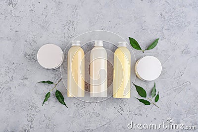 Bottles with spa cosmetic products on grey background Stock Photo