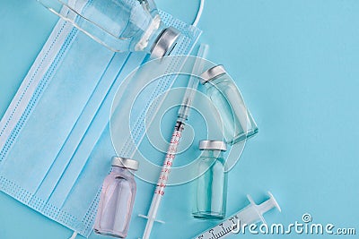 Bottles, syringes and mask Stock Photo