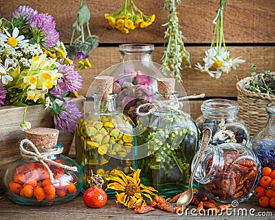 Bottles of tincture and healthy herbs Stock Photo