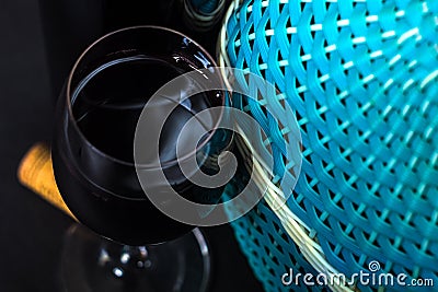 Bottles of wine. Wicker bottle with handle, glass of wine and braided basket Stock Photo